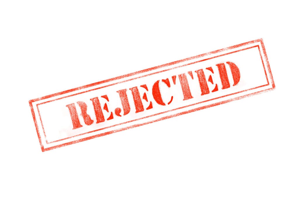 'REJECTED ' rubber stamp over a white background