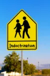 School crossing sign that reads Indoctrination