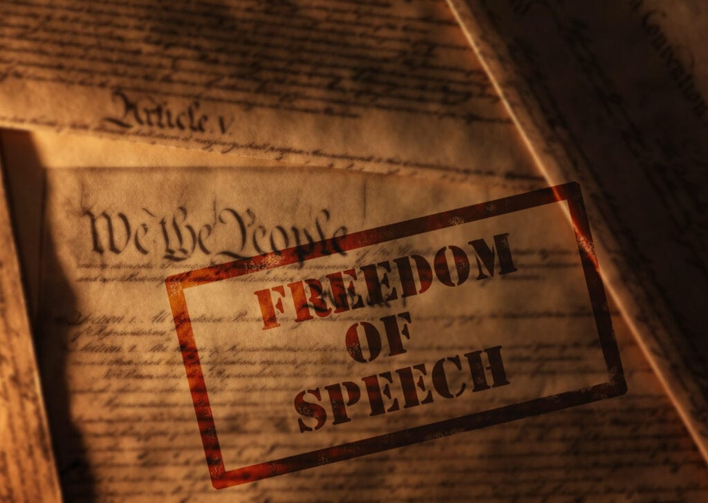 Image depicting the constitution stamped to represent mandatory voting in relation to freedom of speech